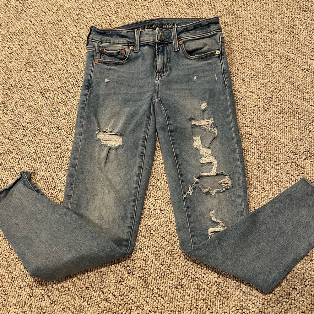 Distressed AE skinny jeans